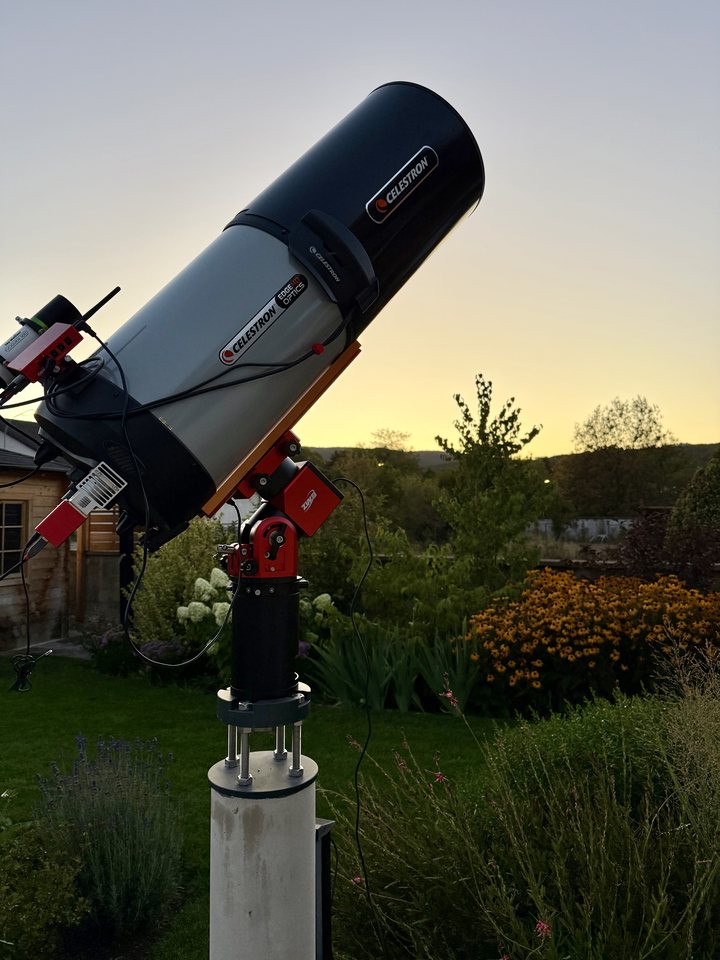 Celestron EdgeHD 11 on a ZWO mount and pier in a garden at dusk