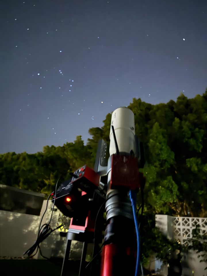 Travel refractor pointed at Thor's Helmet, with Orion above